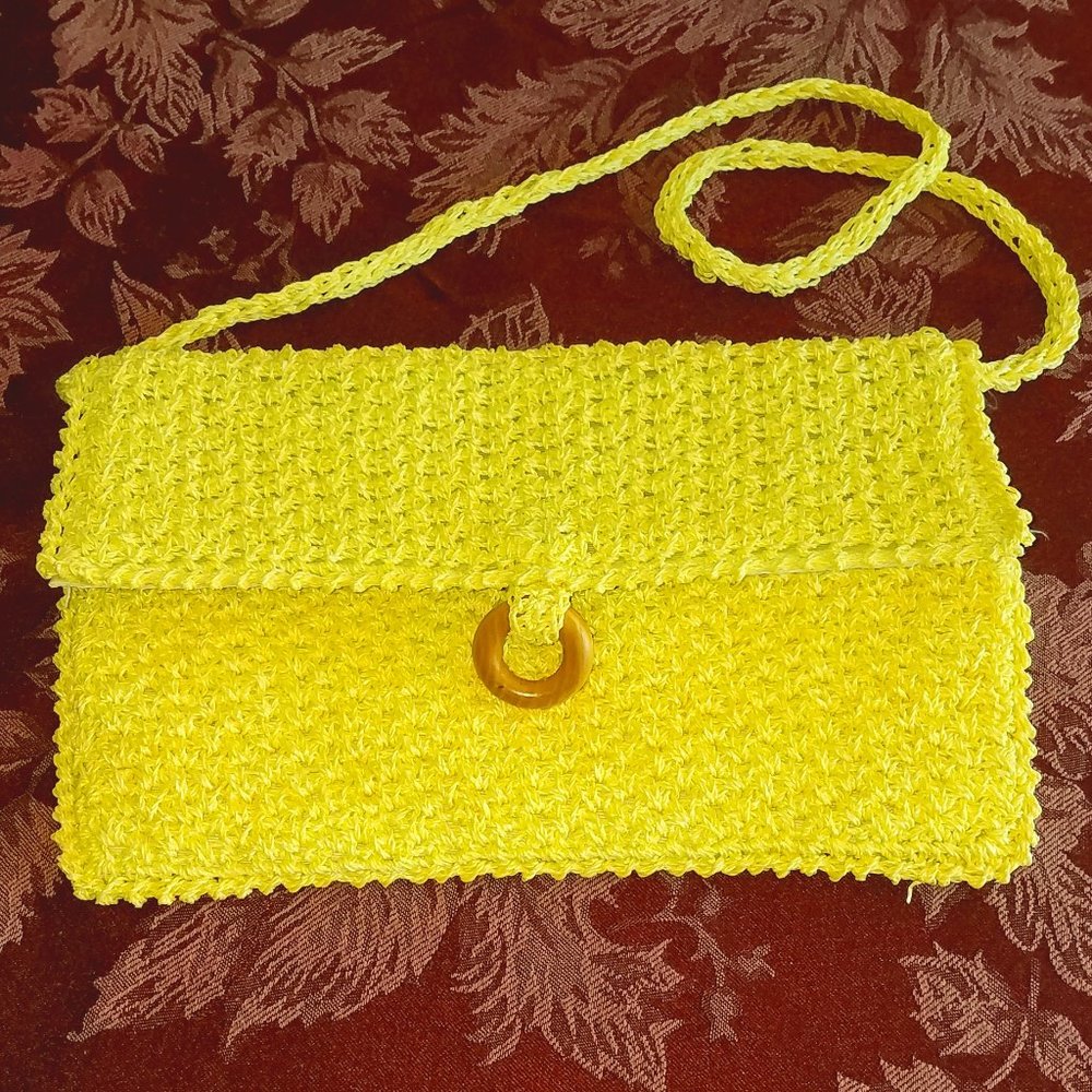 Straw clutch/shoulder purse.